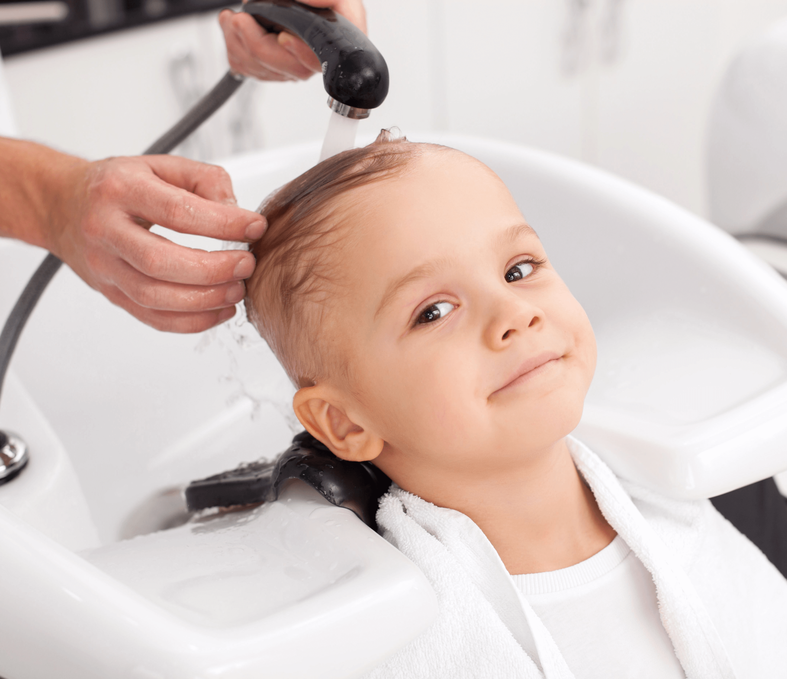 The boy's head is being washed